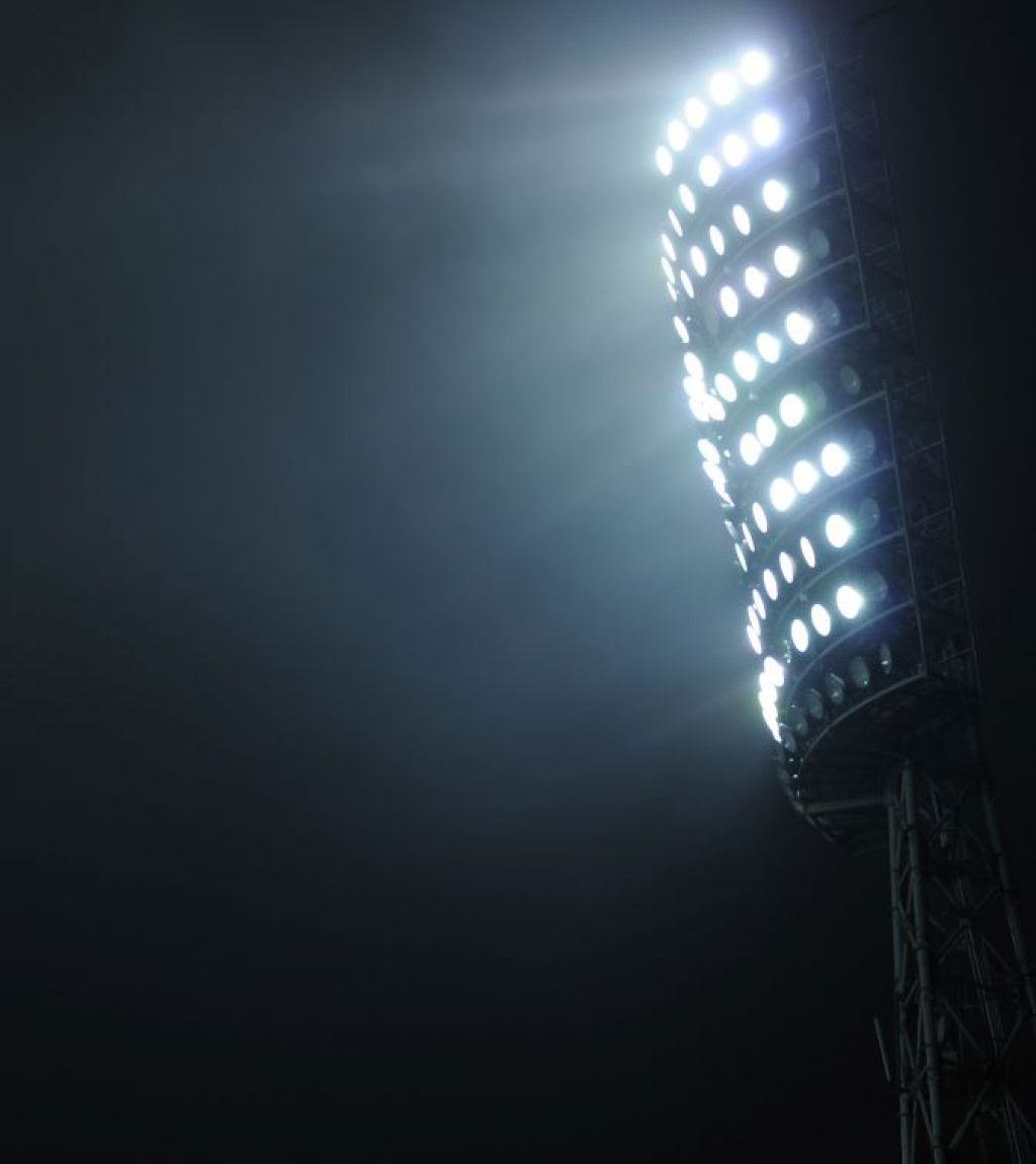 Stadium Lights Against Dark Sky | About Base Sports Group