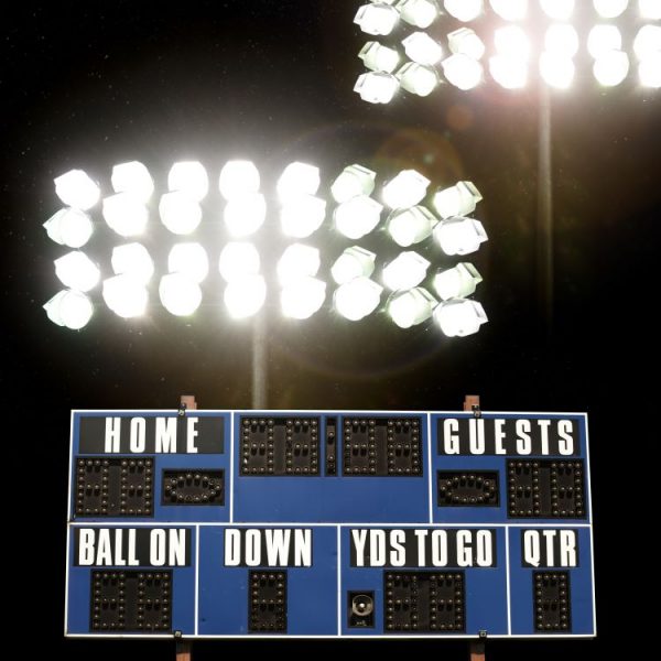 Stadium Lights with Scoreboard | Services to Manage Multimedia Rights